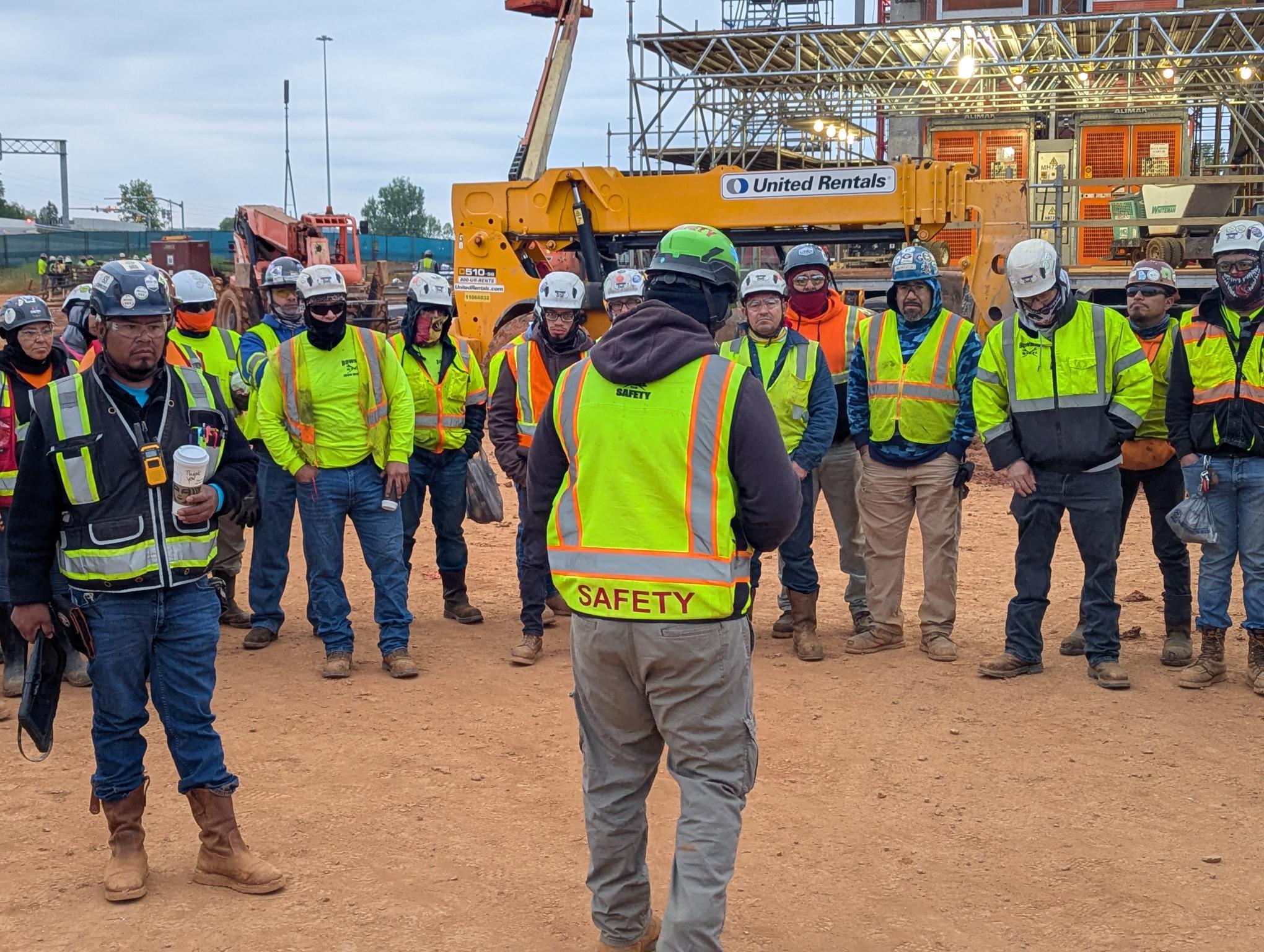 Bowman Steel safety officer leading an on-site safety meeting with the crew